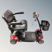 A GoGo Elite Travel mobility cart with key and charger.