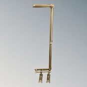 An early 20th century brass fire curb.