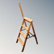 A set of vintage pine folding library steps.