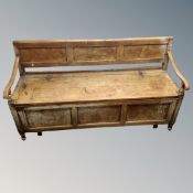 A 19th century pine and beech storage settle.