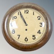 A continental beech framed circular wall clock.