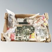 A box containing a quantity of vintage plastic modelling kits and buildings including Airfix.
