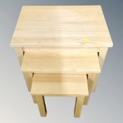 A nest of three contemporary tables.