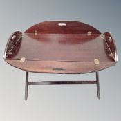 A rectangular butler's tray on stand.