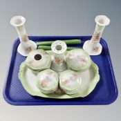 An early 20th century ceramic dressing table set, together with a pair of candlesticks.