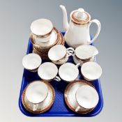 A tray containing Duchess Winchester pattern gilded tea china.