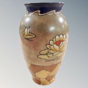 Two Beswick horse figures together with a large glazed pottery vase.