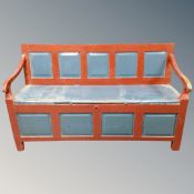 A 19th century painted storage settle.