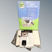 A PetSafe wellness bed together with a medium fold flat crate.
