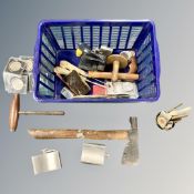 A crate containing commemorative coins, a vintage axe, hip flask etc.