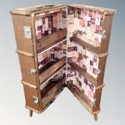 A vintage 20th century wooden bound shipping trunk converted to a cocktail bar.