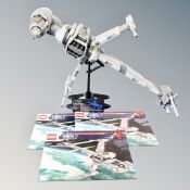 A Lego Star Wars 10227 B-Wing Starfighter, with instructions.