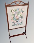 A late 19th century stained beech tapestry fire screen