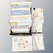 Two boxes containing sealed packs of bedding, Dorma, Curtains, etc.