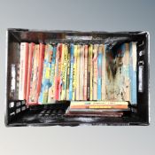 A crate containing a quantity of annuals, vintage Dandy Beanos etc.
