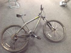 A Genesis Core 10 gent's front suspension mountain bike.