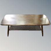 An Ercol stained elm and beech coffee table with under shelf.