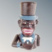 A cast iron novelty Jolly Boy money box.