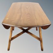 An Ercol elm and beech model 384 drop leaf table