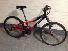 A Specialised Hotrock child's front suspension mountain bike.