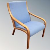 A late 20th century beech framed blue armchair