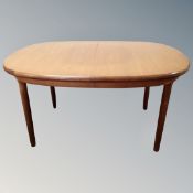 A 20th century teak G-plan oval extending dining table