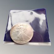 A 1992 US silver dollar.