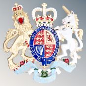 A cast iron coat of arms wall plaque.