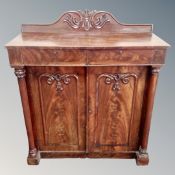 A Victorian mahogany double door chiffoniere fitted with two drawers and pillar column supports.