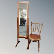 A cheval mirror together with an antique Ibex kitchen chair