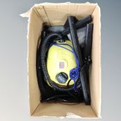 A steam cleaner with accessories and an Epson multi-function printer.