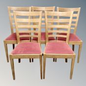A set of five contemporary oak ladder backed dining chairs
