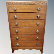 A 1930's oak six drawer chest.