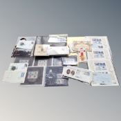 A box containing assorted coinage, coin covers, silver jubilee stamps,