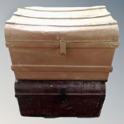 Two antique tin trunks.