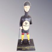 A cast iron Guinness jockey money box.