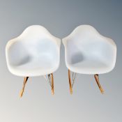 A pair of blue moulded plastic rocking chairs on hair-pin legs after a design by Charles and Ray