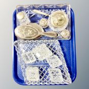 A tray containing 1930s cut glass dressing table sets, a pair of silver lidded dressing table jars,