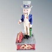 A cast iron novelty Uncle Sam money box.
