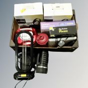 A box containing electricals including DAB radio, boxed Sony wireless headphones, torches, tablet,