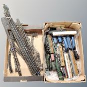 Two boxes containing a quantity of Hornby rolling stock and OO gauge track.