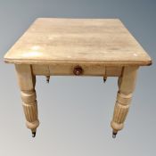 A Victorian pine dining table