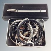 A boxed bookmark/pen together with SOS talisman, Cathy Van Leeland key fob,