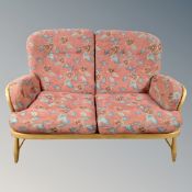 An Ercol elm and beech Windsor two seater settee