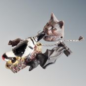 Three cast iron door knockers, cat's head, bat and woodpecker.