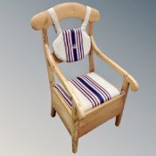 A 19th century Scandinavian pine storage armchair