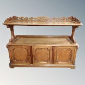 A Victorian oak dumbwaiter stand