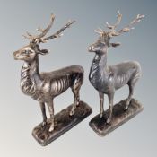 A pair of cast iron stag figures.