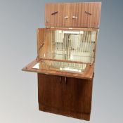 A mid 20th century walnut cocktail cabinet