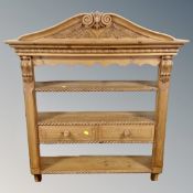 A contemporary pine antique-style carved wall rack